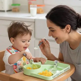 Unbreakable baby feeding plate from Univers Nest with non-slip bottom, colorful divided compartments for easy toddler meals.