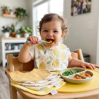 Ultra absorbent baby bib from Univers Nest, showing soft fabric and adjustable neck strap for comfortable feeding protection.