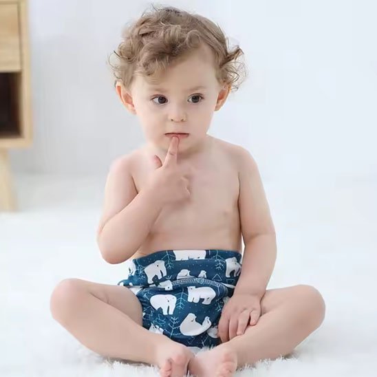 Reusable cloth diaper from Univers Nest, eco-friendly washable diaper with adjustable snaps and soft fabric for comfort.