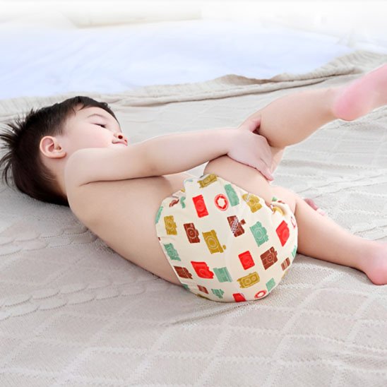 Reusable eco-friendly cloth diaper from Univers Nest showing soft fabric and adjustable snaps for comfortable baby wear.