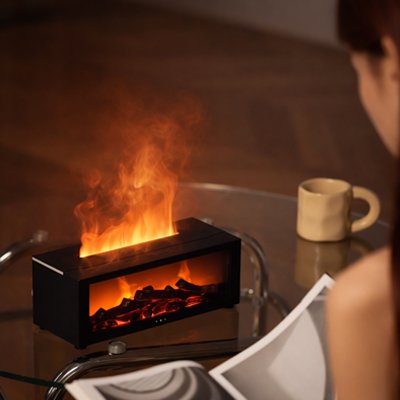 Pure Breath air humidifier by Univers Nest shown on a bedside table with a sleek white design and mist output.
