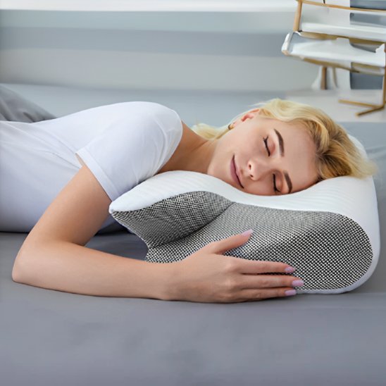Ergonomic pillow by Univers Nest with contoured design for comfort and support during sleep or relaxation.
