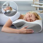 Ergonomic pillow by Univers Nest featuring contoured support for neck and head comfort, shown in a neutral fabric cover.