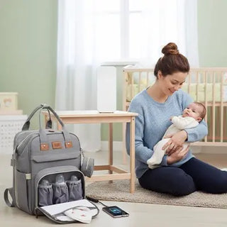 Univers Nest multifunction diaper bag with multiple compartments and adjustable straps, shown in a sleek, practical design.
